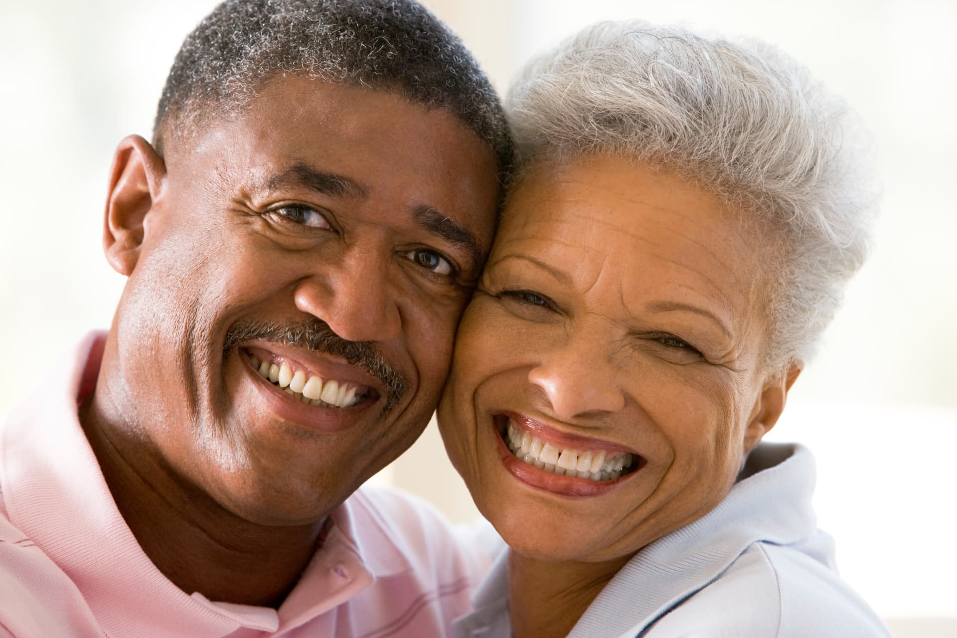 A smiling senior couple relaxing together indoors